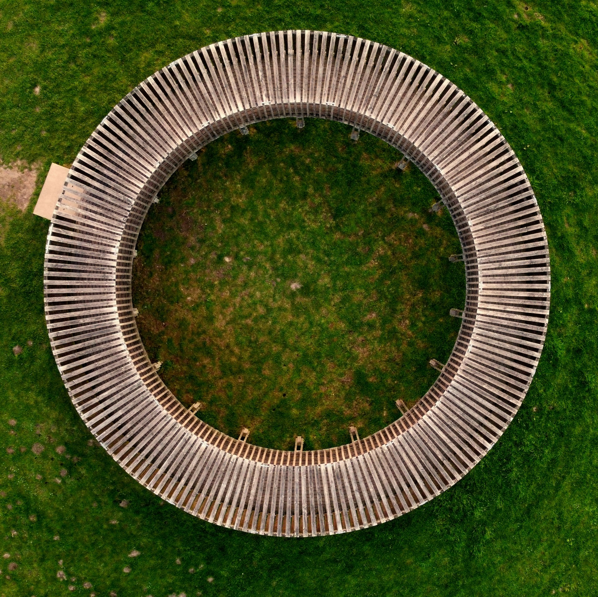 round silver ring on green textile